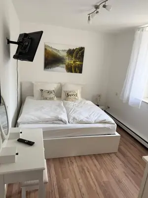 Ein Bett oder Betten in einem Zimmer der Unterkunft Wohnen am Reiterhof, 50 qm, mit Gartennutzung