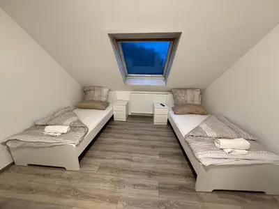 Ein Bett oder Betten in einem Zimmer der Unterkunft Apartment Wuppertal 4P Küche