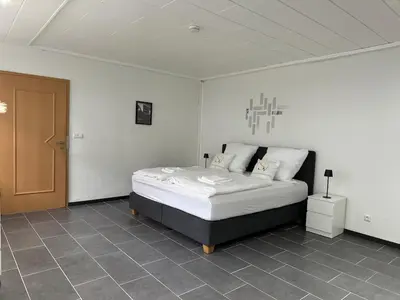 Ein Bett oder Betten in einem Zimmer der Unterkunft Entspannung pur! Privater Kinosaal & Whirlpool