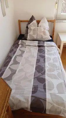 Ein Bett oder Betten in einem Zimmer der Unterkunft Monteurwohnung Fekete