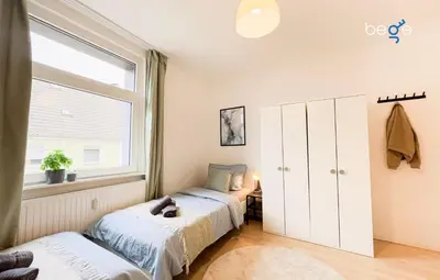 Ein Bett oder Betten in einem Zimmer der Unterkunft BEGE APARTMENTS Team Base
