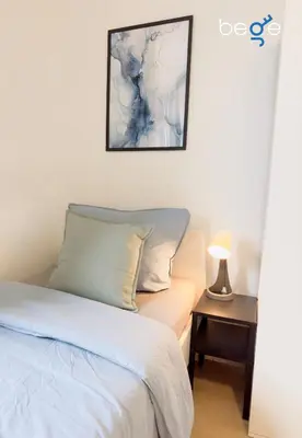 Ein Bett oder Betten in einem Zimmer der Unterkunft BEGE APARTMENTS Team Base