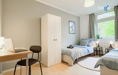 Ein Bett oder Betten in einem Zimmer der Unterkunft BEGE APARTMENTS Team Base