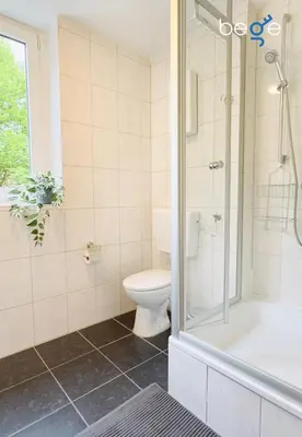 Ein Badezimmer in der Unterkunft BEGE APARTMENTS Team Base