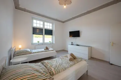 Ein Bett oder Betten in einem Zimmer der Unterkunft HagenStay Eilpe 1