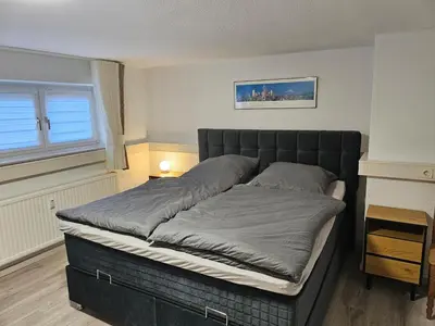 Ein Bett oder Betten in einem Zimmer der Unterkunft Aurora Apartment in Essen