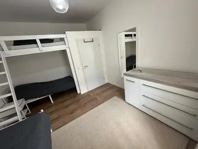 Ein Bett oder Betten in einem Zimmer der Unterkunft gemütliche Wohnung in Witten