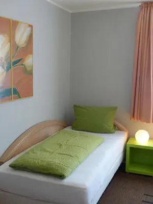 Ein Bett oder Betten in einem Zimmer der Unterkunft Haus der Gastlichkeit
