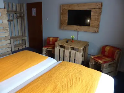 Ein Bett oder Betten in einem Zimmer der Unterkunft Haus der Gastlichkeit