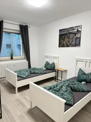 Ein Bett oder Betten in einem Zimmer der Unterkunft Stilvolles Apartment Royal Zentral Ruhig & Parkplatz inkl