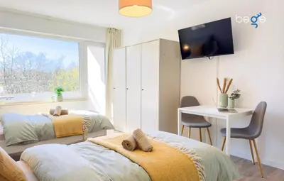 Ein Bett oder Betten in einem Zimmer der Unterkunft BEGE APARTMENTS BizConnect