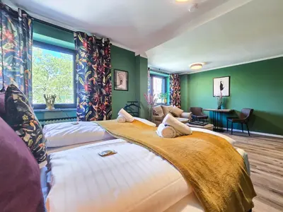 Ein Bett oder Betten in einem Zimmer der Unterkunft Alpha Apartments