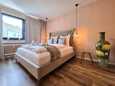 Ein Bett oder Betten in einem Zimmer der Unterkunft Alpha Apartments