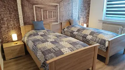 Ein Bett oder Betten in einem Zimmer der Unterkunft FeWo Marjenza