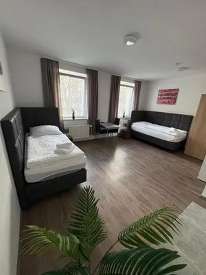 Ein Bett oder Betten in einem Zimmer der Unterkunft Ferienwohnung Evelyn