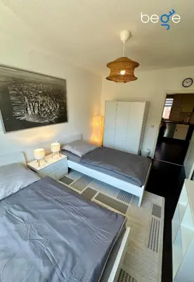 Ein Bett oder Betten in einem Zimmer der Unterkunft BEGE APARTMENTS BusinessSide