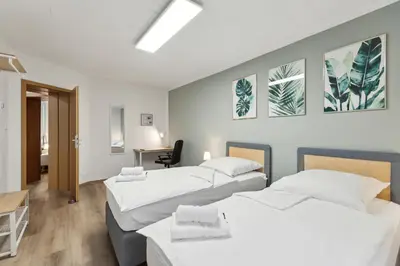 Ein Bett oder Betten in einem Zimmer der Unterkunft Rudi Homes Essen #2