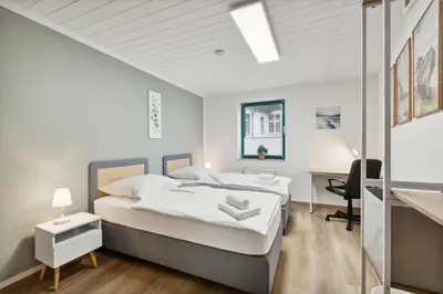 Ein Bett oder Betten in einem Zimmer der Unterkunft Rudi Homes Essen #2