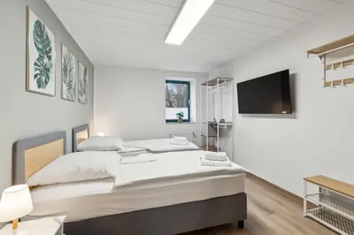 Ein Bett oder Betten in einem Zimmer der Unterkunft Rudi Homes Essen #2
