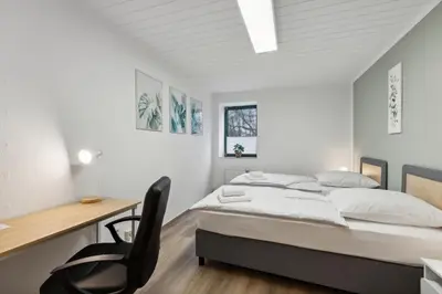 Ein Bett oder Betten in einem Zimmer der Unterkunft Rudi Homes Essen #2