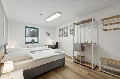 Ein Bett oder Betten in einem Zimmer der Unterkunft Rudi Homes Essen #2