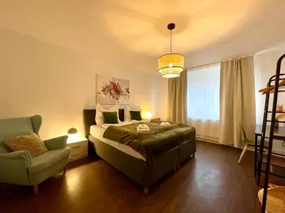 Ein Bett oder Betten in einem Zimmer der Unterkunft King's Apartement - MODERN NEST APARTEMENTS