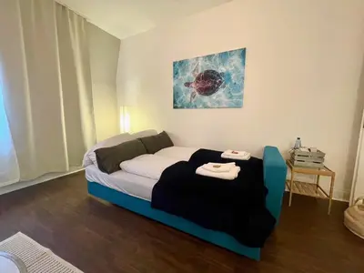 Ein Bett oder Betten in einem Zimmer der Unterkunft King's Apartement - MODERN NEST APARTEMENTS