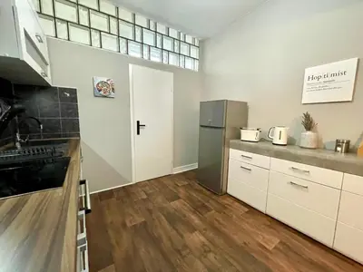 Küche/Küchenzeile in der Unterkunft King's Apartement - MODERN NEST APARTEMENTS