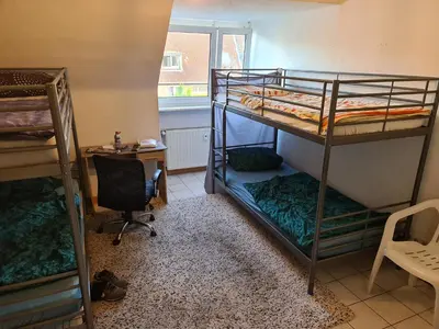 Ein Bett oder Betten in einem Zimmer der Unterkunft Raum in AE max 4 B