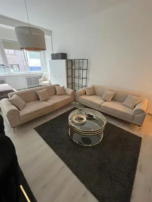 Ein Sitzbereich in der Unterkunft Modernes City Apartment am Limbecker Platz Essen
