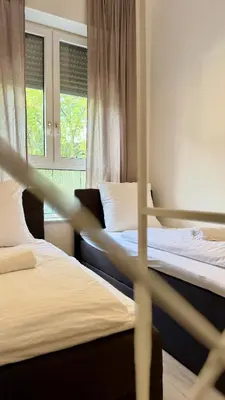 Ein Bett oder Betten in einem Zimmer der Unterkunft Perfect for fans and travelers