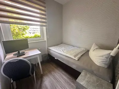 Ein Bett oder Betten in einem Zimmer der Unterkunft Bach's Restaurant Bar Hotel