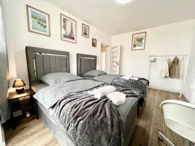 Ein Bett oder Betten in einem Zimmer der Unterkunft Zentrale City Ferienwohnung Essen 3 Zimmer Balkon Messe