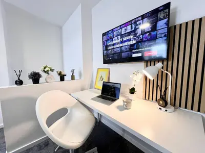 TV/Unterhaltungsangebot in der Unterkunft Zentrale City Ferienwohnung Essen 3 Zimmer Balkon Messe
