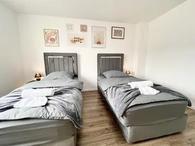 Ein Bett oder Betten in einem Zimmer der Unterkunft Zentrale City Ferienwohnung Essen 3 Zimmer Balkon Messe