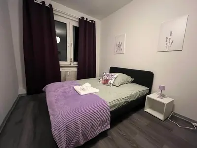 Ein Bett oder Betten in einem Zimmer der Unterkunft Lavendel Wohnung