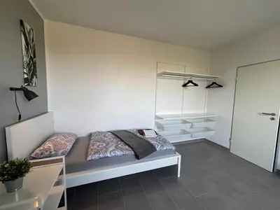 Ein Bett oder Betten in einem Zimmer der Unterkunft Moderne 3,5 Zimmer 85m2 & Balkon Wohnung