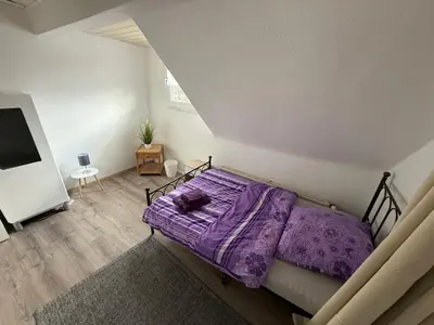 Ein Bett oder Betten in einem Zimmer der Unterkunft Haus Fröhlich