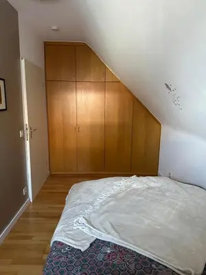 Ein Bett oder Betten in einem Zimmer der Unterkunft Oase für Reisende & Geschäftsleute
