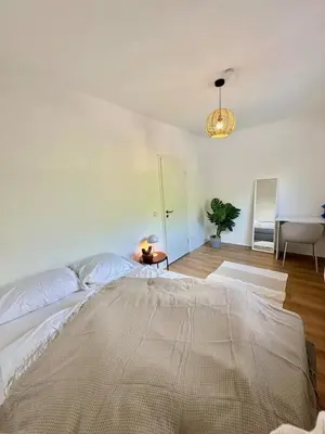 Ein Bett oder Betten in einem Zimmer der Unterkunft Stilvoll - Designwohnung nahe Westfield Centro