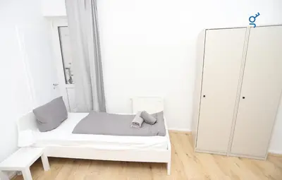 Ein Bett oder Betten in einem Zimmer der Unterkunft BEGE APARTMENTS WorkBase