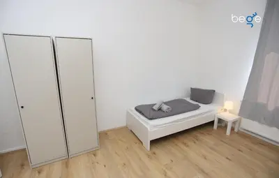 Ein Bett oder Betten in einem Zimmer der Unterkunft BEGE APARTMENTS WorkBase