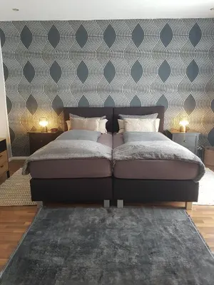 Ein Bett oder Betten in einem Zimmer der Unterkunft Einführungspreis Gemütliche Auszeit - Designwohnung - 4 Sterne Hotelboxspringbetten - Küche - Familie - Erdgeschoss