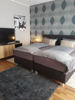 Ein Bett oder Betten in einem Zimmer der Unterkunft Einführungspreis Gemütliche Auszeit - Designwohnung - 4 Sterne Hotelboxspringbetten - Küche - Familie - Erdgeschoss