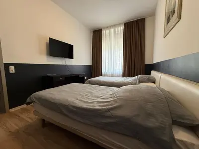Ein Bett oder Betten in einem Zimmer der Unterkunft Cici Monteurunterkünfte Altena City Wohnung für Handwerker