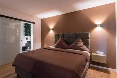 Ein Bett oder Betten in einem Zimmer der Unterkunft Boutiquehotel Reuter GmbH