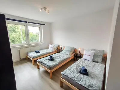 Ein Bett oder Betten in einem Zimmer der Unterkunft homes of ruhr - Monteurwohnung Halde