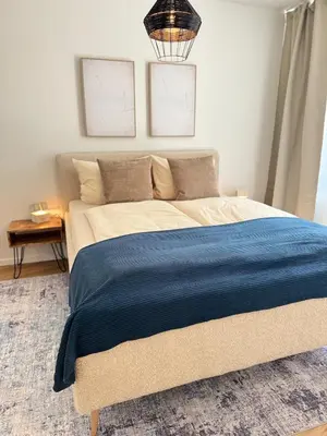 Ein Bett oder Betten in einem Zimmer der Unterkunft Cozy Apartment Wolke2 mit Balkon