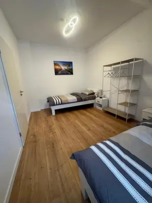 Ein Bett oder Betten in einem Zimmer der Unterkunft DERKO Apart 2