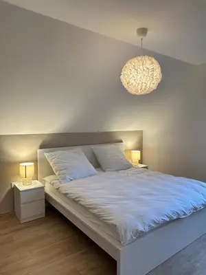 Ein Bett oder Betten in einem Zimmer der Unterkunft Moderne Ferienwohnung